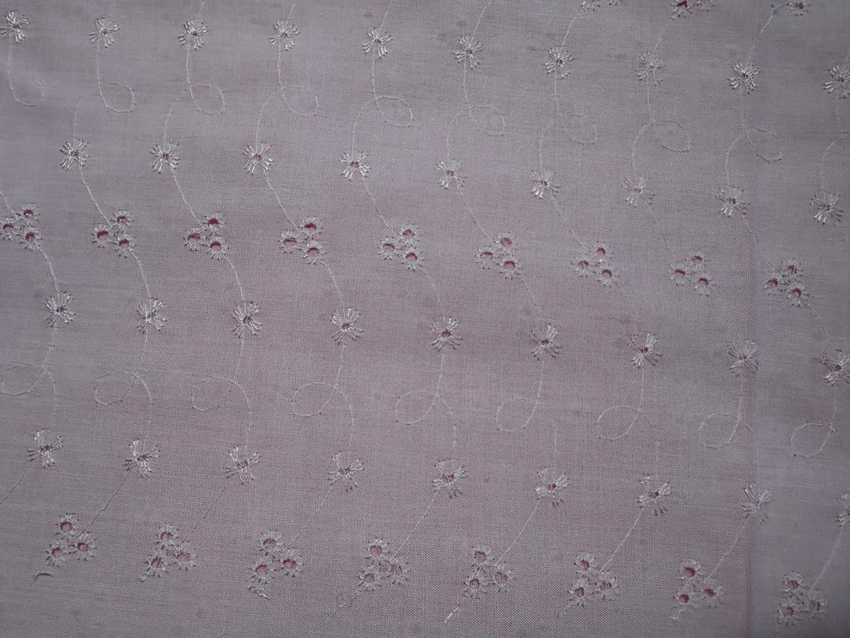 Pale pink broderie anglaise fabric with delicate white floral embroidery, 60 inches wide