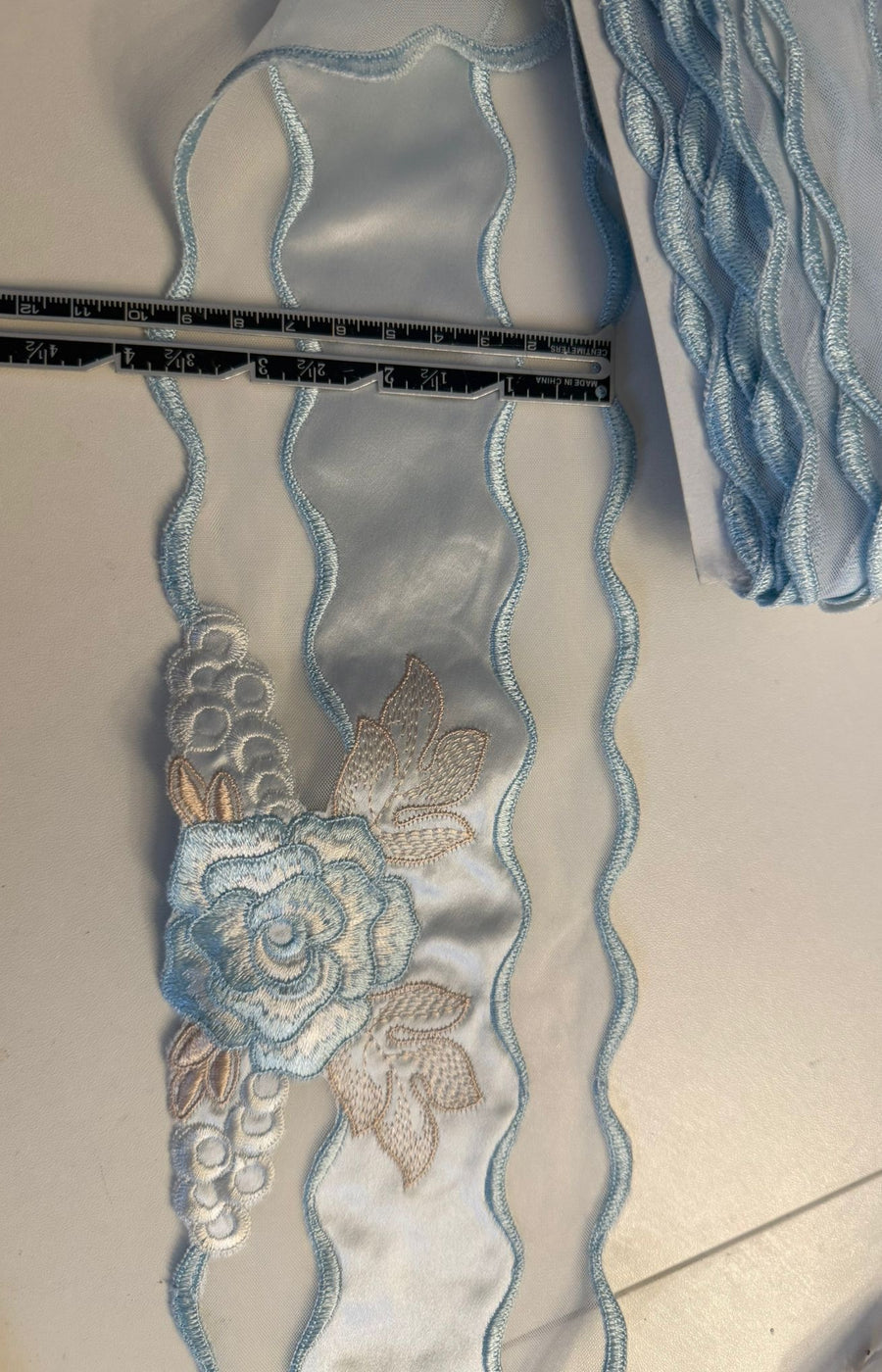 Satin Embroidered Trim – Pale Blue | 100mm Wide — exact-product supporting merchandising close-up, same product, inspiration only