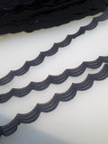 Black Austrian guipure lace with repeating scalloped wave pattern, 12mm wide