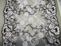 Black and ivory embroidered floral tulle with decorative lace edging