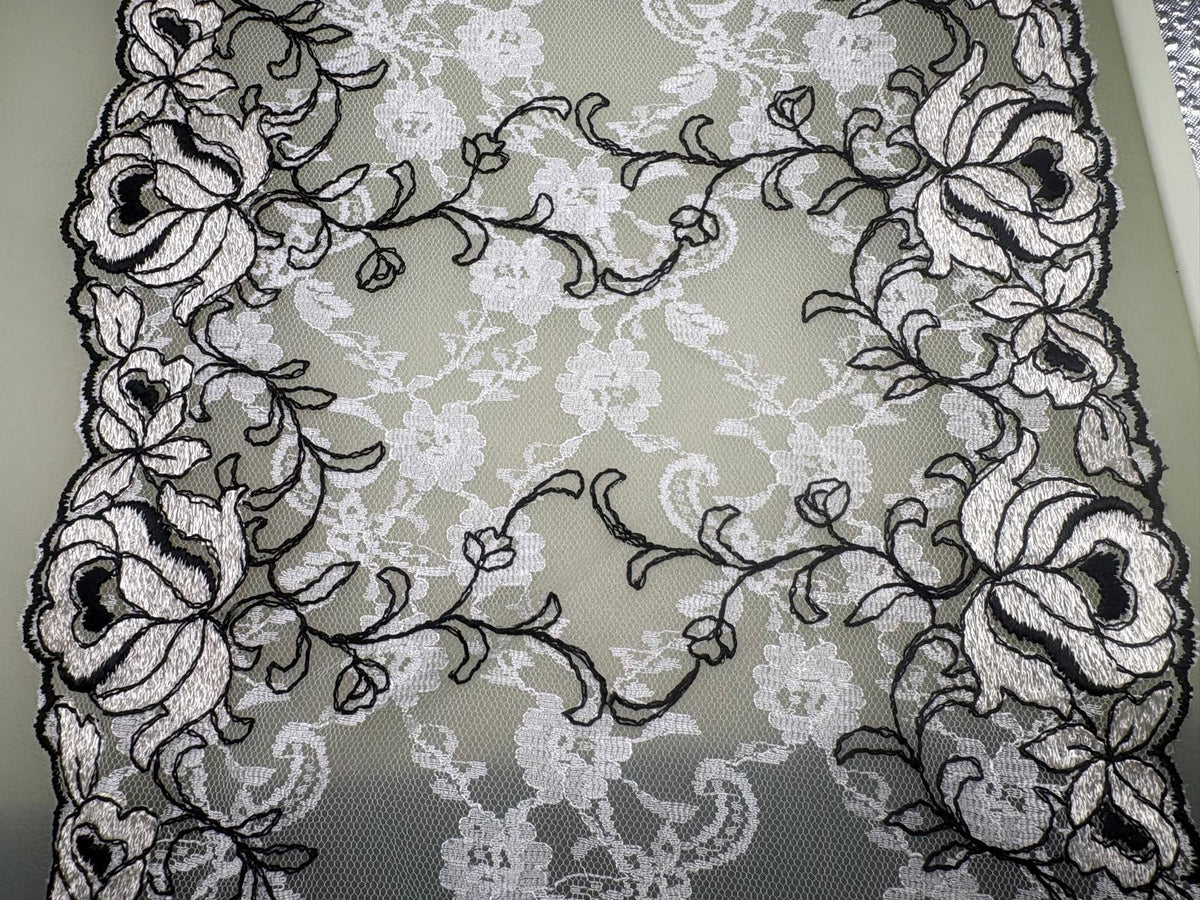 Black and ivory embroidered floral tulle with decorative lace edging