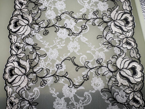 Black and ivory embroidered floral tulle with decorative lace edging