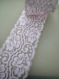 Pink couture-style stretch lace with textured openwork pattern