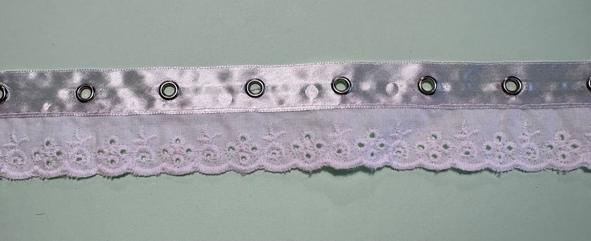 White broderie anglaise trimmed eyelet ribbon with silver eyelet detail, 45mm wide, seconds stock